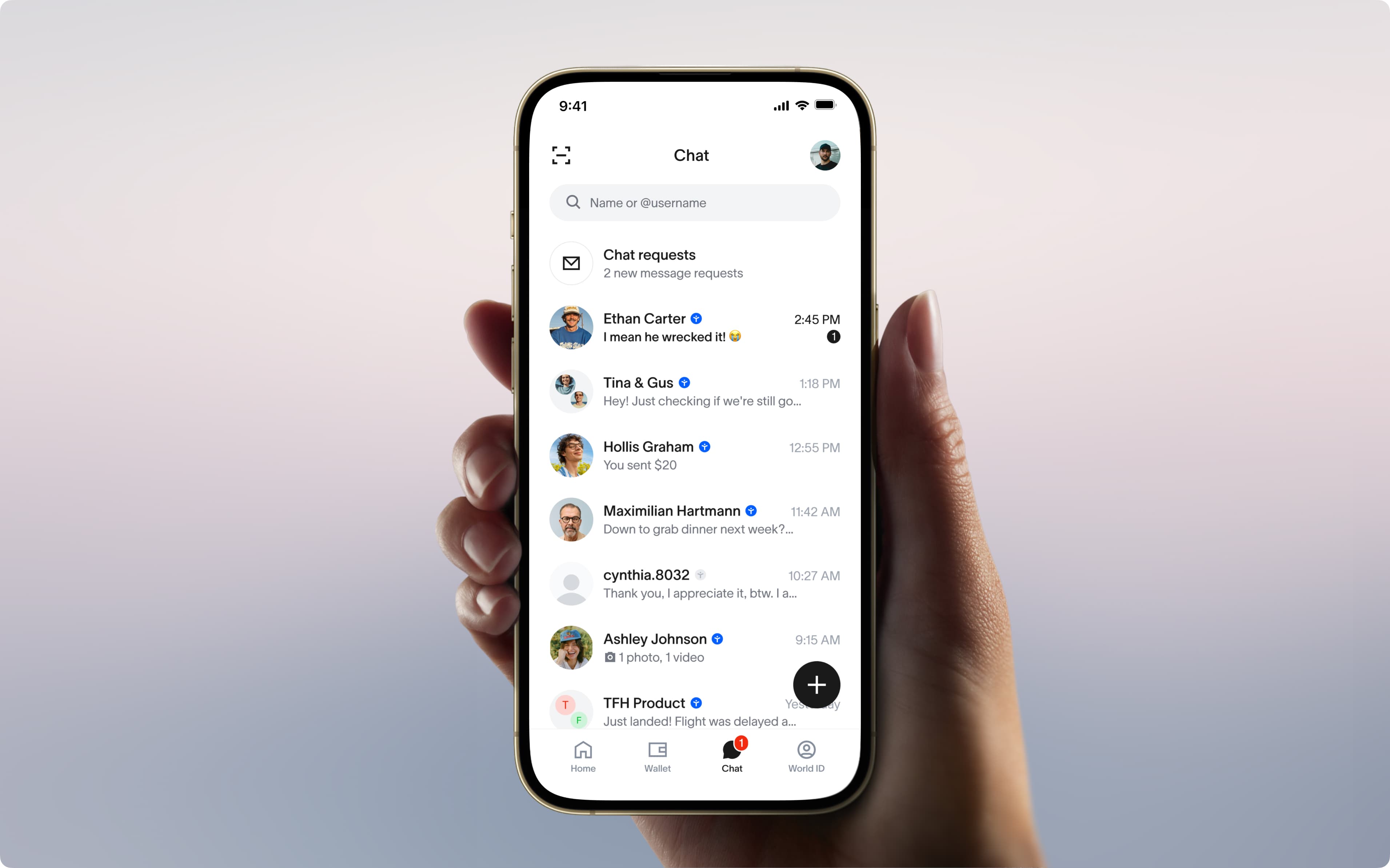 Hand holding a phone running World Chat